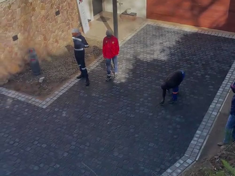 Paved access way running between two buildings